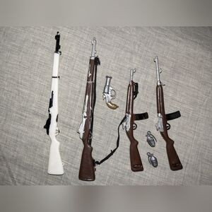 Vintage 1960s GI Joe rifles and weapons.